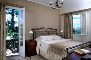A bed or beds in a room at Dafnoudi Hotel Apartments