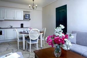 A kitchen or kitchenette at Dafnoudi Hotel Apartments