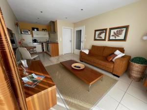 a living room with a couch and a table at Lakeview Appartements in Zeuthen