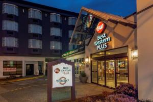 a best western plus hotel sign in front of a building at Best Western Plus Vancouver Airport Hotel in Vancouver