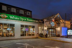a building with a white spot restaurant sign on it at Best Western Plus Vancouver Airport Hotel in Vancouver