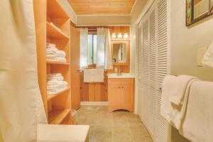 a bathroom with a sink and a mirror at River Dance Retreat - Meredith Lodging in Welches +42 photos