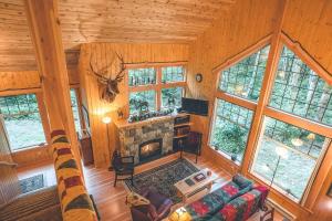 an overhead view of a living room with a fireplace at Cedar Springs Cabin - Meredith Lodging in Welches