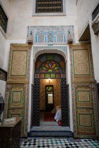 an entrance to a room with two ornate doors at Dar Panoramic Fez in Fès