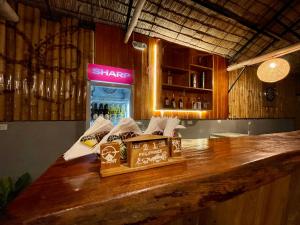 a bar with a box of chocolates on a counter at MOMO Hostel in Moalboal