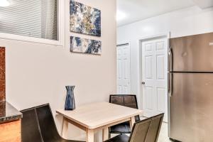 a kitchen with a table and a refrigerator at Spacious&stylish 2bd apt with great location! in Philadelphia