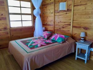 Ένα ή περισσότερα κρεβάτια σε δωμάτιο στο Fare Hanuatai
