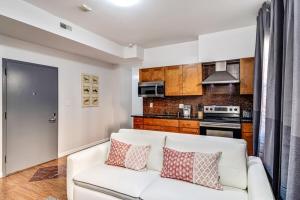 a living room with a couch and a kitchen at Cozy and stylish 2BD Apt with great location! in Philadelphia