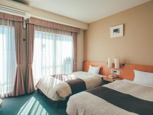 Postel nebo postele na pokoji v ubytování Kuretake Inn Okayama