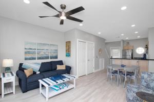 a living room with a couch and a table at Majestic Marina Villa- 2 bedroom Village at Hawks Cay in Duck Key