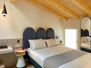 A bed or beds in a room at Relais Sant'Anna