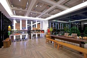a store with tables and benches in a room at Renyi Lake Hotel in Fanlu