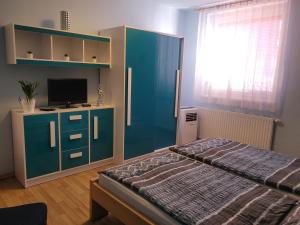 Postel nebo postele na pokoji v ubytování Penzion u Mikulinců