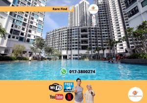 a billboard of a swimming pool in a city at Rasa Sayang Homestay @ I-Soho, I-City in Shah Alam