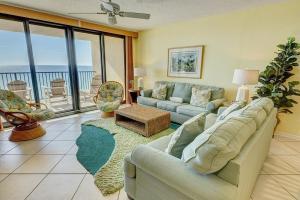 a living room with a couch and a table at Windrift 410W in Orange Beach
