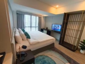 Televisyen dan/atau pusat hiburan di VIVA LA VIDA HOTEL