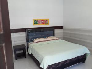Postel nebo postele na pokoji v ubytování Manuh Guest House