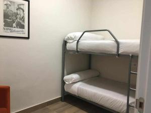 Ένα ή περισσότερα κρεβάτια σε δωμάτιο στο KubiK APARTAMENTOS K1