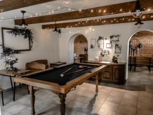 a billiard room with a pool table in it at Wczasy od Maluszka do Staruszka in Ryglice