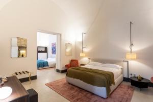 Letto o letti in una camera di Palazzo De Noha - Boutique Hotel