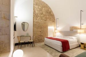 Letto o letti in una camera di Palazzo De Noha - Boutique Hotel