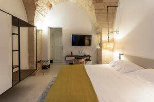 Letto o letti in una camera di Palazzo De Noha - Boutique Hotel