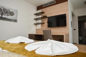 a room with a table with two white objects on it at Hotel Meduza in Senj