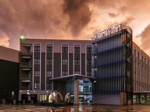 een weergave van een hotel met een gebouw bij The Grand Aria Hotel and Conference Centre in Gaborone