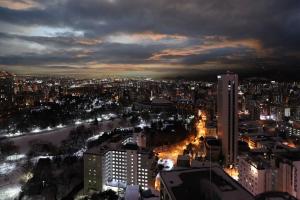 a city at night with a river and buildings at Meteor Shower in Sapporo