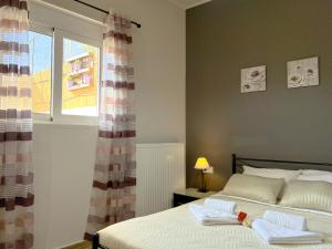 Posteľ alebo postele v izbe v ubytovaní Antigoni's Studio Cozy Private Apartment