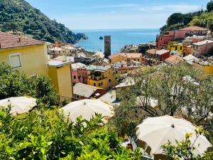 a view of a city with umbrellas at Albergo Degli Amici in Monterosso al Mare