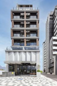 an architectural rendering of a building with balconies at The Moment Hotel Hualien by Lakeshore in Shunan