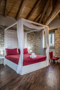 En eller flere senge i et værelse på Albergo del Bramante