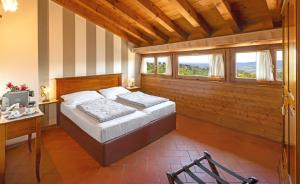 Een bed of bedden in een kamer bij Agriturismo Casa Rosa