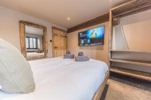 Ένα ή περισσότερα κρεβάτια σε δωμάτιο στο Quirky Retreats - The Barn
