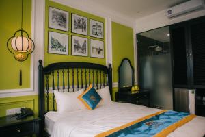 Giường trong phòng chung tại Alee Haiphong Hotel