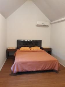 Postel nebo postele na pokoji v ubytování Manuh Guest House