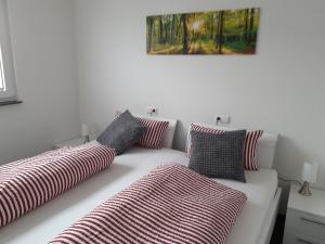 two pillows on a couch in a room at Ferienwohnung Marek in Friedrichshafen