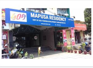 a building with a sign for a restaurant at Mapusa Residency in Mapusa