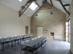 a large room with a long table and chairs at Les Chambres du Meunier in Juigné-sur-Loire
