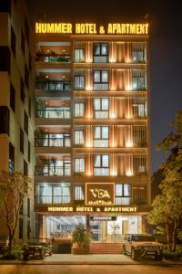 a hotel building with a sign that reads hunter hotel and apartment at Hummer Hotel & Apartment Da Nang Beach in Da Nang