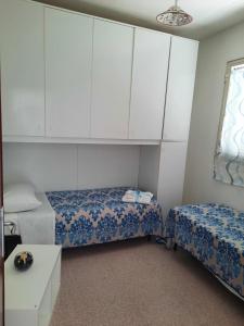 En eller flere senge i et værelse på Villetta Paradiso