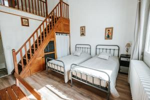 Postel nebo postele na pokoji v ubytování Relais des combrailles