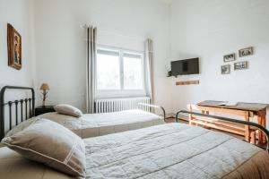 Postel nebo postele na pokoji v ubytování Relais des combrailles