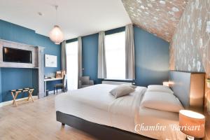 Voodi või voodid majutusasutuse Hôtel l'Ecrin d'Ô toas
