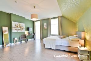 Voodi või voodid majutusasutuse Hôtel l'Ecrin d'Ô toas
