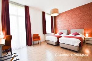 Voodi või voodid majutusasutuse Hôtel l'Ecrin d'Ô toas