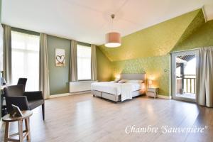 Voodi või voodid majutusasutuse Hôtel l'Ecrin d'Ô toas