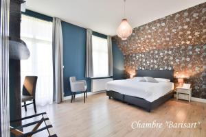 Voodi või voodid majutusasutuse Hôtel l'Ecrin d'Ô toas