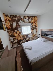 Postel nebo postele na pokoji v ubytování Garni Hotel & Spa Nicolo
